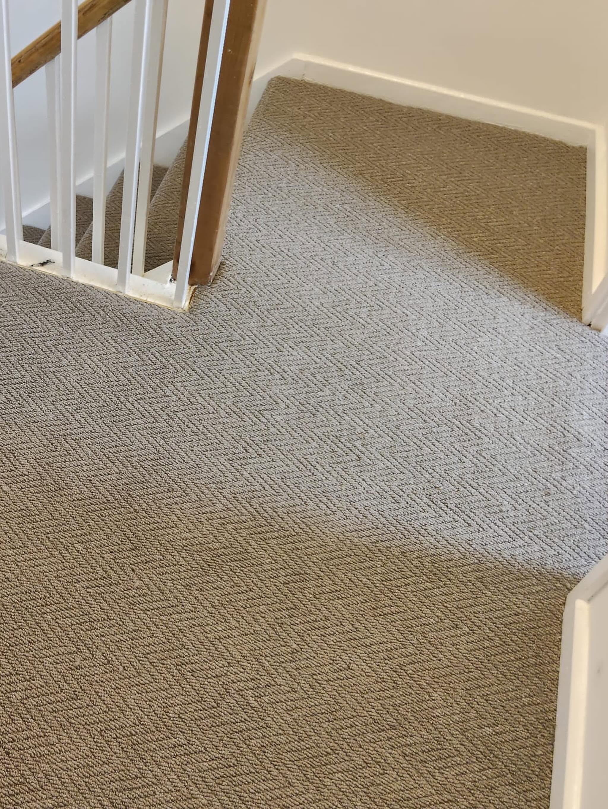 Herringbone carpet fitted to a staircase landing