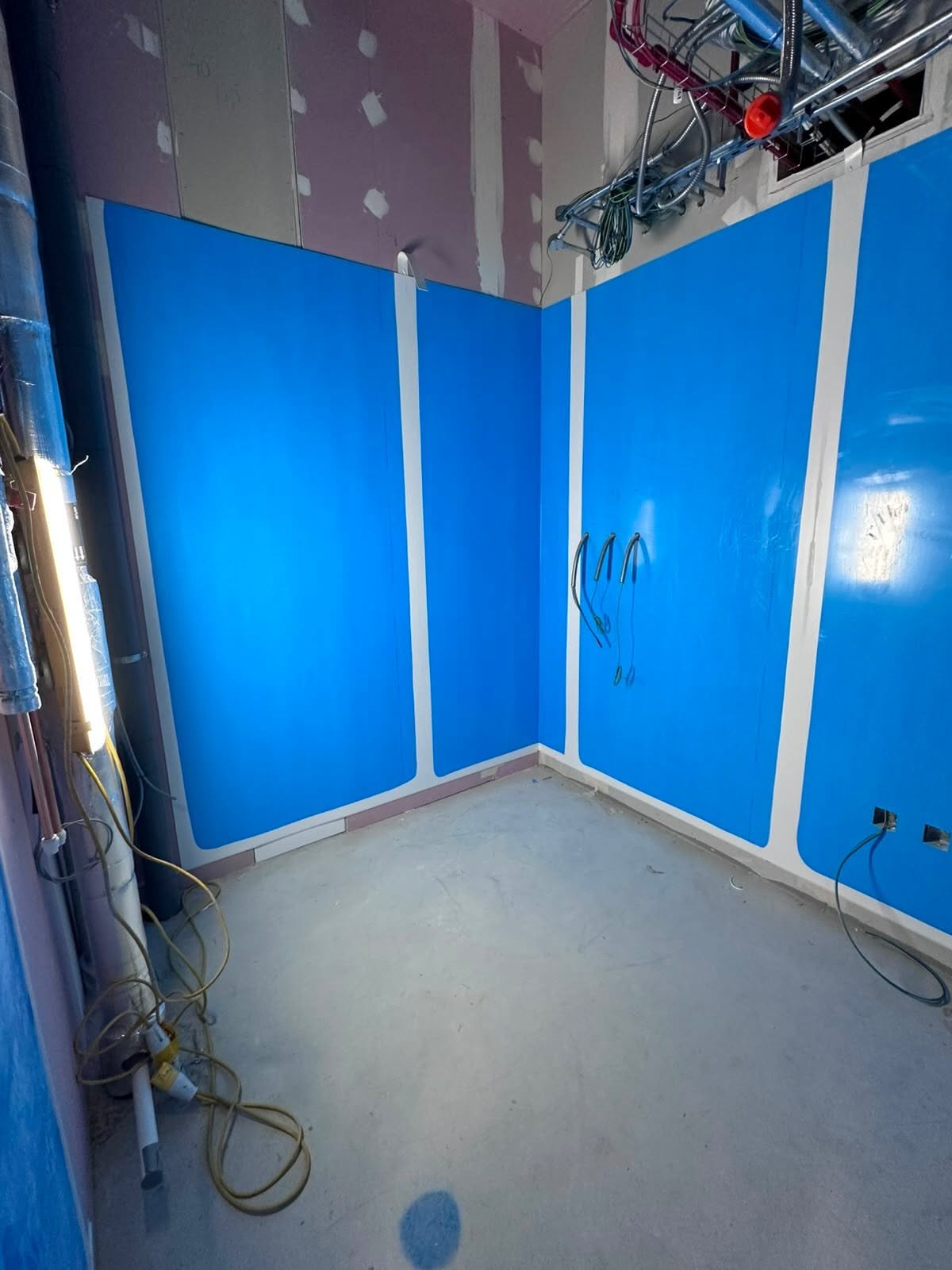 Commercial interior with hygienic cladding and exposed ceiling services
